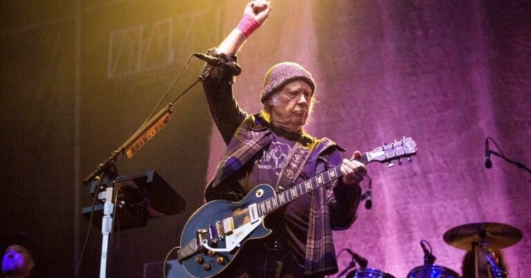 Neil Young back on for Glastonbury music festival, citing 'an error in the information received'